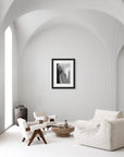 ‘Orchid' – black and white art print presented in a black frame, shown in a minimalist living room.